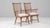 This pair of 20th Century French wooden lounge chairs features a refined yet relaxed silhouette, blending clean lines with...