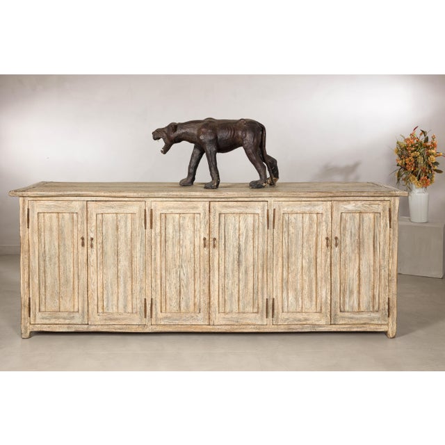 This large rustic sideboard combines the generous scale of a European enfilade with the practical function of a media...