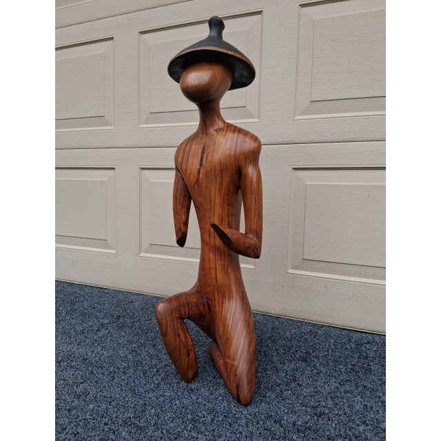 Vintage, minimalist hand carved Sculpture. . The use of Exotic & Tropical Hardwood with this piece is fabulous!. What does...