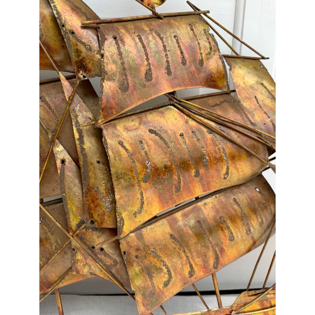 Here is a wonderful, brutalist inspired sculptural metal depiction of a schooner with full sails and waving flags. The...