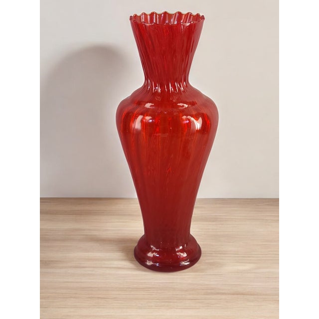 Captivate your space with the vibrant hues of this Vintage Mid-Century Modern Italian Red Opaline Vase. Exquisitely...
