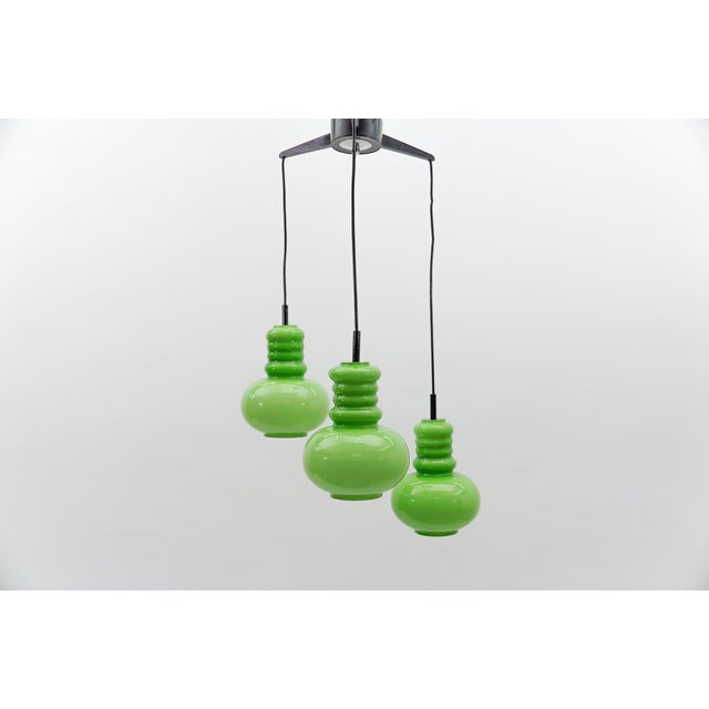 Lovely 3-light apple green glass cascading lamp by peill & putzler, 1960s the lamp needs 3x e14 / e15 edison screw fit...