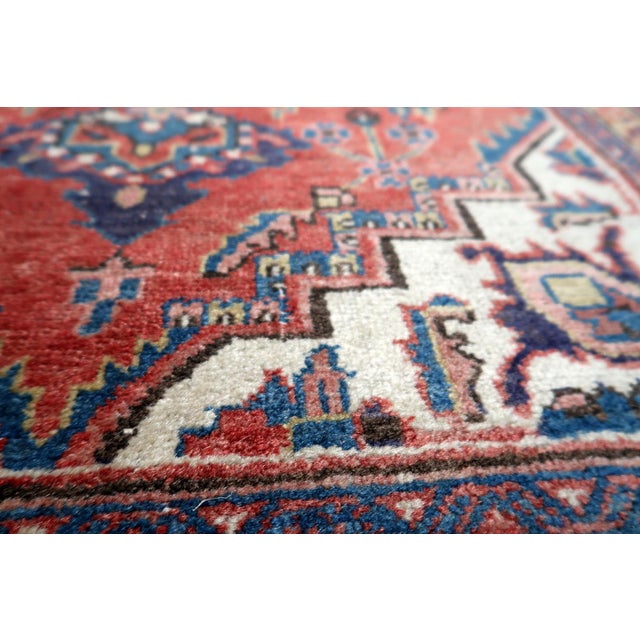 An exceptional Antique Persian Heriz Rug hand-knotted in wool from the renowned Heriz region of Persia, dating to circa...