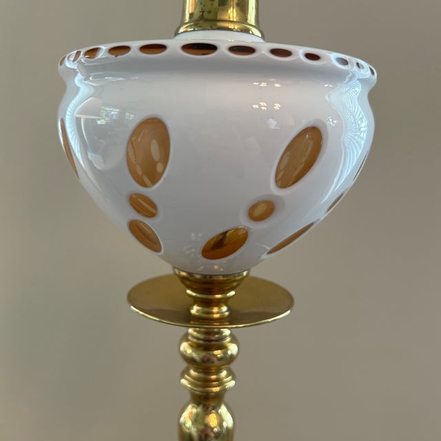 Bring a touch of Hollywood Regency glam to your space with this vintage brass and glass table lamp. The combination of...