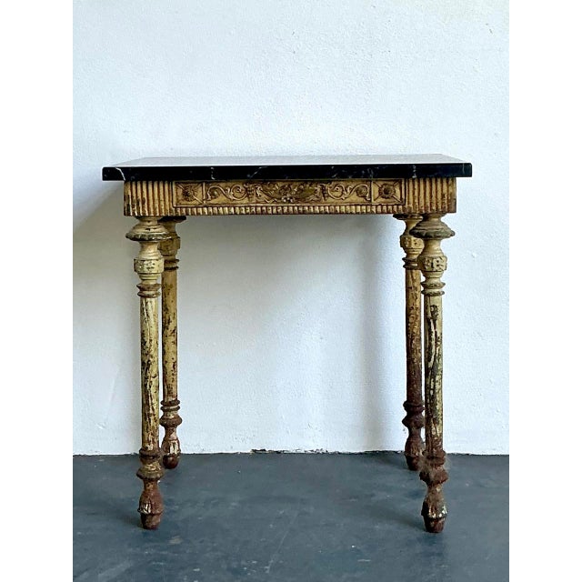 This sophisticated side table is a masterclass in Neoclassical design, drawing significant inspiration from the refined...
