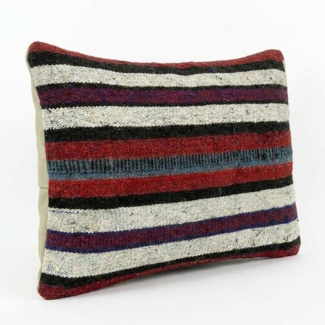 This beautiful 14'' x 20'' hand-woven Kilim pillow cover was made from an authentic Turkish kilim. The traditional flat-...