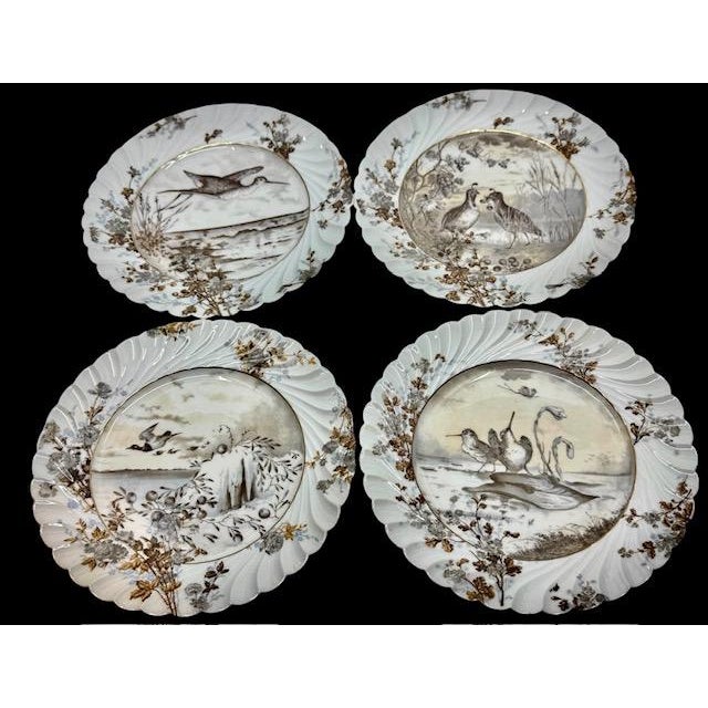Exceptional collection of four antique Haviland & Co. Limoges porcelain decorative plates, dating to approximately 1887....