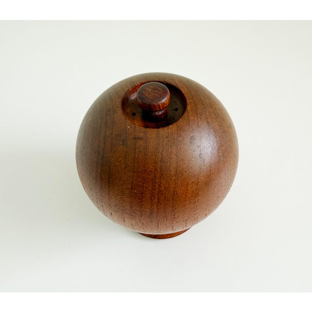 A solid teak wood peppermill and salt shaker set with the design attributed to Jens Quistgaard and manufactured by Nissen,...
