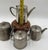 A Moroccan silver-plated tea set handmade by Berrad Maroc Abdelkrim, comprising three matching teapots and one sugar...