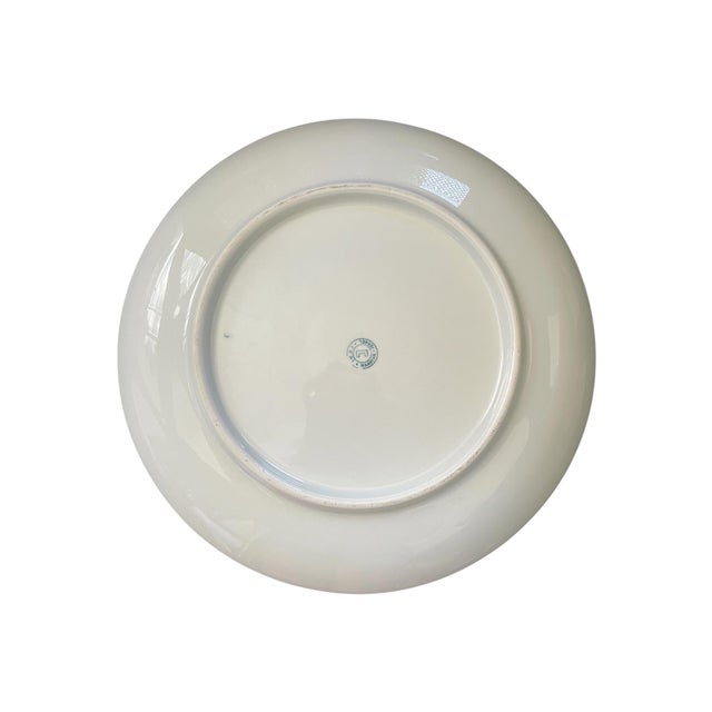 Vintage midcentury porcelain dinner plate from Naaman Israel, 11" in diameter. Pattern is white with fruit-- berries in...