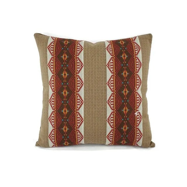 This pillow features brown and red stripes in a southwestern pattern. This pillow has brown, red, dark brown, white, and a...