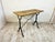 Crafted with a weathered solid oak plank top resting on an elegant cast iron base, this vintage French table reflects the...