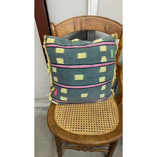 A pair of custom made decorative throw pillows, sized 18" X 17" made of vintage African Baule cloth from the Ivory Coast....