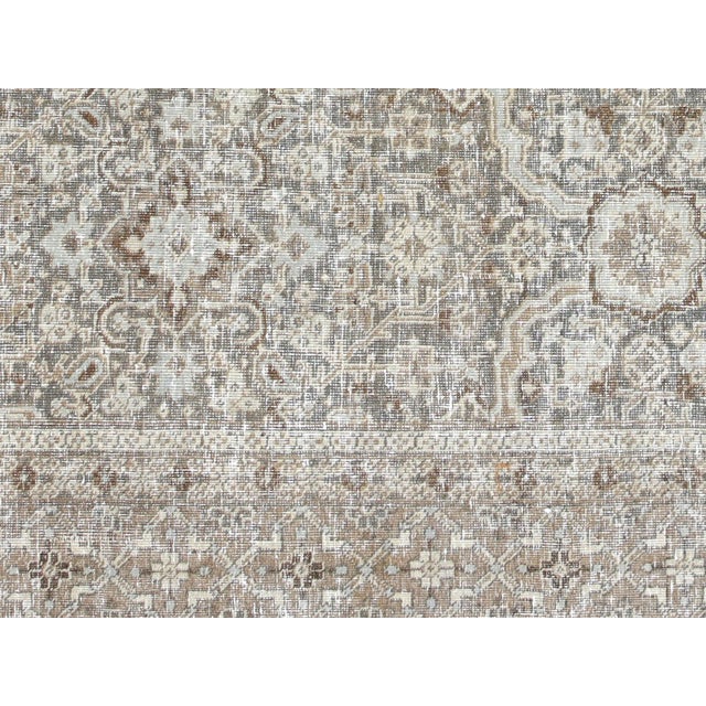 This lavish hand-knotted Persian Tabriz rug adds the perfect touch of elegance to any space. Its intricate design features...