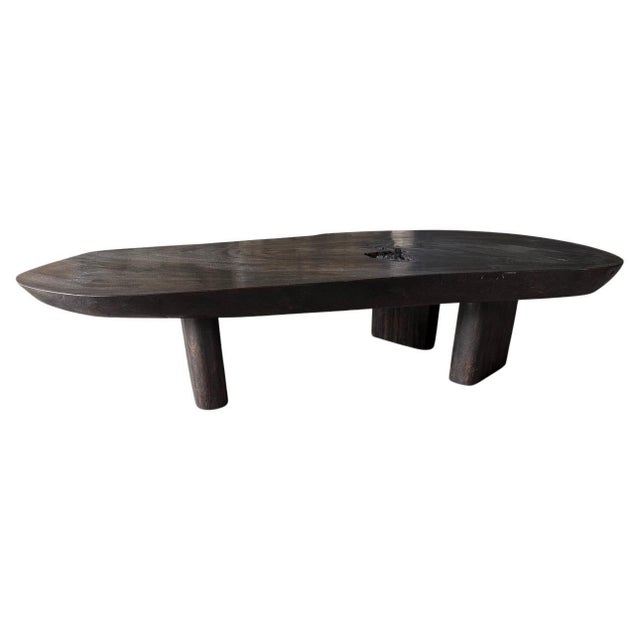 Impressive reclaimed four inch slab suar wood coffee table, floating on three minimalist legs. Charred, sanded and sealed...