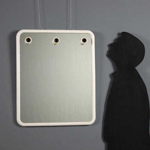 Vintage mirror with three light points and white plastic frame. This piece is attributed to the mentioned designer/maker....