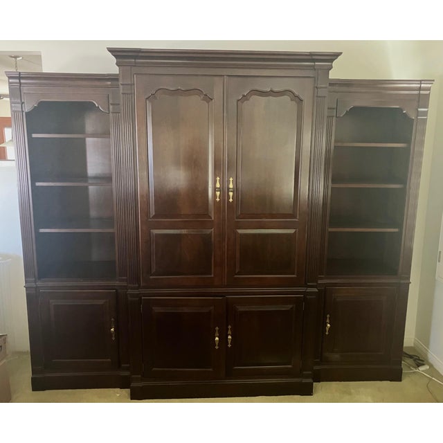 This is a truly magnificent piece of L. & J.G. Stickley solid cherry wood furniture in superb condition. A television was...