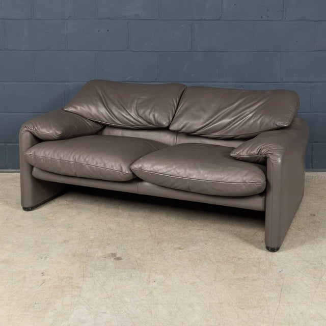An iconic Italian Maralunga two-seat sofa designed by Vico Magistretti for Cassina, dating from the late 20th century....
