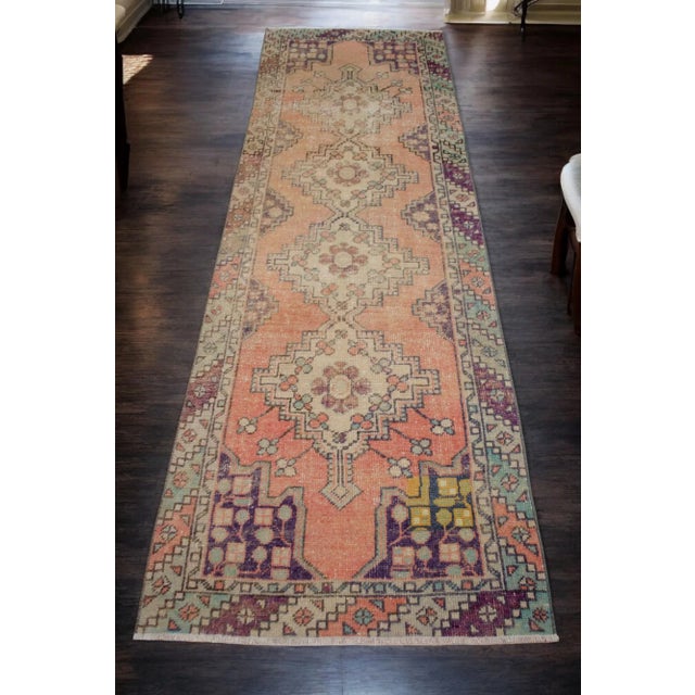 Quadruple center medallion atop an unusual faded orange field. Diagonal striped border of alternating colors. Awesome...