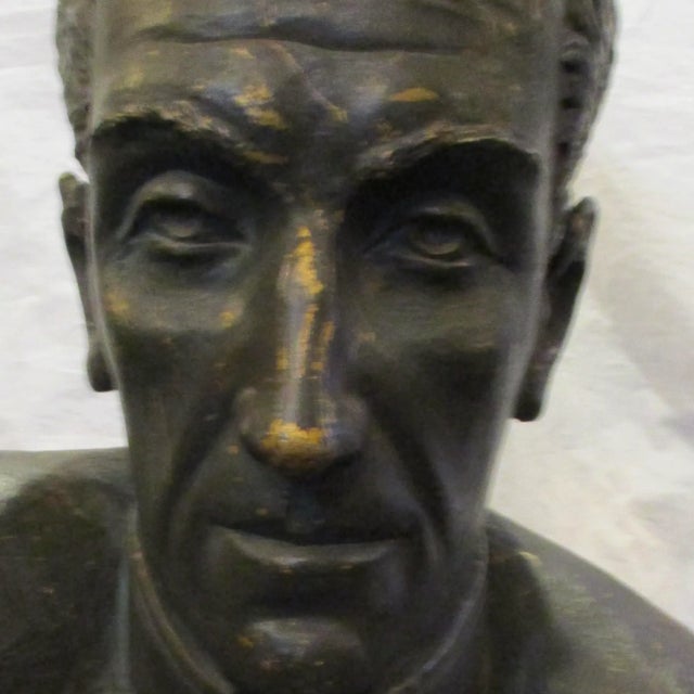 Plaster studio bust of Bolivar by Nichola Veloz. Sculpted in a monumental over-life size scale and Patinated dark olive...