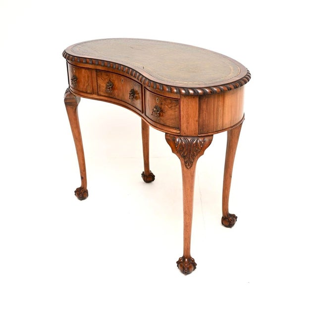 A beautiful antique burr walnut leather top kidney shaped desk. This was made in England, it dates from around the...