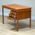 Handcrafted in Denmark during the 1960s by Dominos Møbler , this elegant Mid-Century teak desk is the smaller version ,...