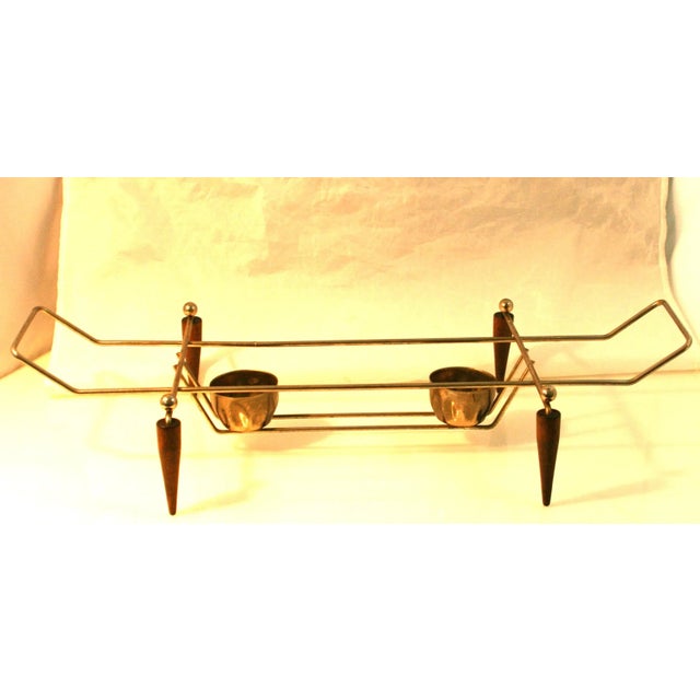 Mid-Century Modern Teak & Gold Tone Metal Rectangular Footed Casserole Stand Warmer This rectangle-shaped casserole stand...