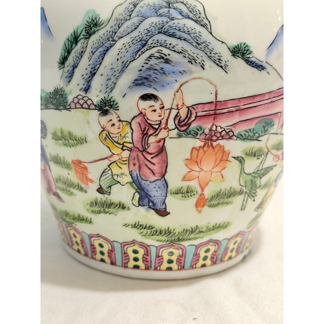 This bespoke Turtle and Crane find is a vibrant vintage porcelain vase that perfectly balances the drama of Famille Noire...