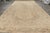 Hand knotted in wool circa 1930-40, this oversized 11x21 antique Kerman Lavar rug is an especially rare and exciting new...