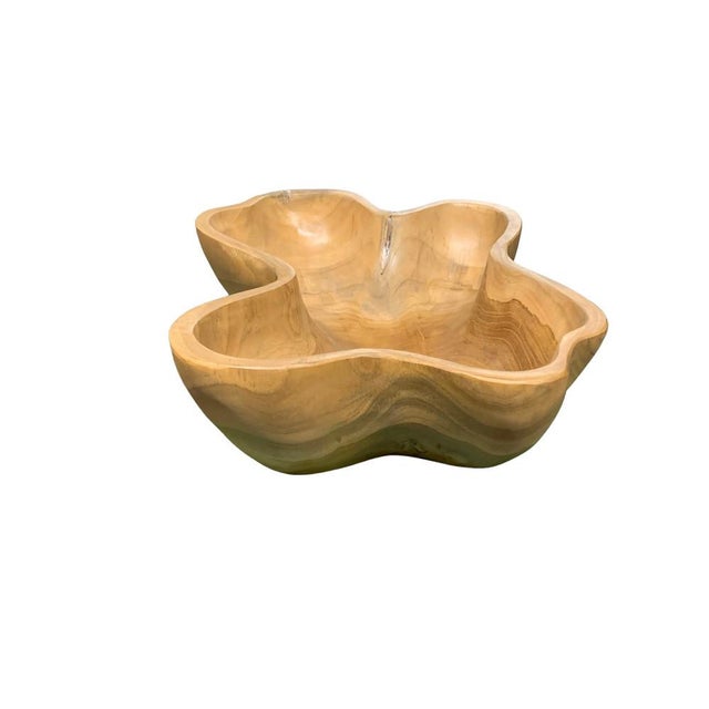 This teak live edge bowl is a unique piece showcasing the natural beauty of teak wood. Crafted by skilled artisans, its...