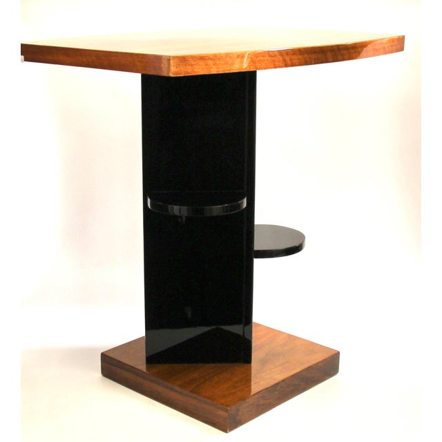 This rectangular side table with a curved tabletop on two sides, in classic Art Deco style, dates from the 1930s and is...