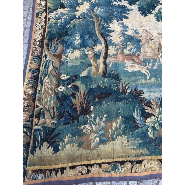 Beautiful 18th-century Aubusson tapestry depicting an elegant hunting scene set in the heart of a wooded landscape. The...