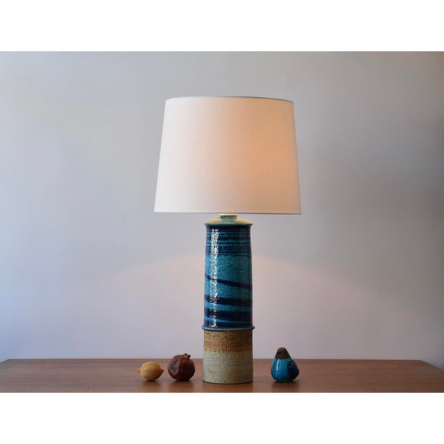 Tall stoneware table lamp by Inger Persson for Rörstrand, Sweden. Manufactured in the 1960s. The lamp is partly glazed...