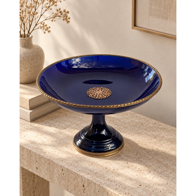 Elegant french pedestal tazza or compote in deep cobalt blue porcelain, dating from the late 19th century. the wide...