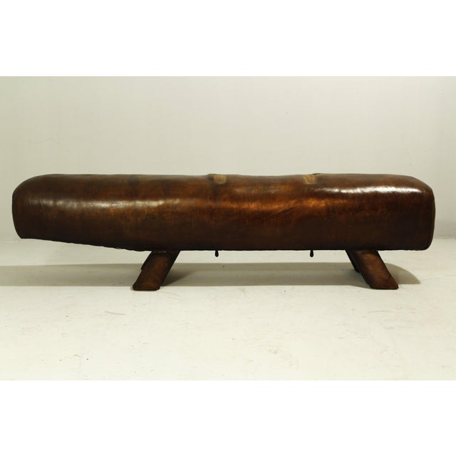 A gymnastics bench from the 1900s; the leather has been treated with saddle oil. Beautiful, rich patina. Very early work....