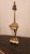 This listing features a Louis XVI style bronze gilt lamp, not wired or plugin. Comes with a lampshade that is not original...