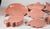 Set of plates in the shape of fish ceramic worked salmon pink marked with the writing portugal s consists of 12 small...