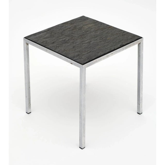 French side table with a chrome metal base and stone top. The superb lines of this piece are clean and striking;...