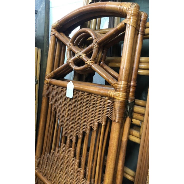 The Folding Screen with Rattan and Woven Wicker panels is a charming 3-panel room divider featuring butterfly hinges for...