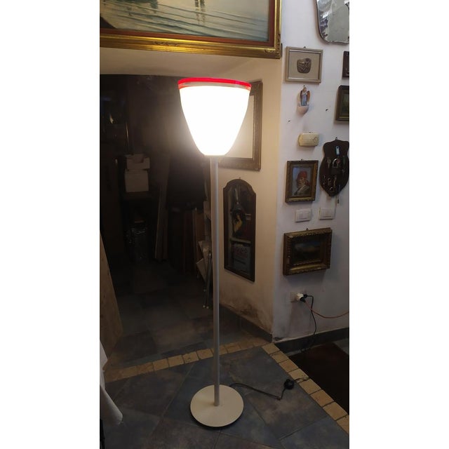 This lamp was handmade in Murano in the 70s and is to be considered a unique piece. Very thick glass. Metal rod and base....