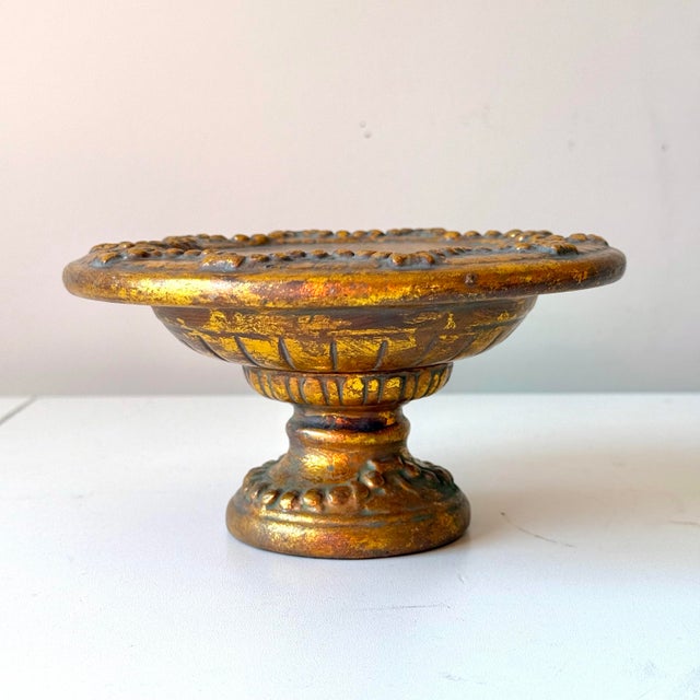 Vintage gold leaf ceramic topiary stand with bow and scallop motif relief accents. Perfect for seasonal topiary display...