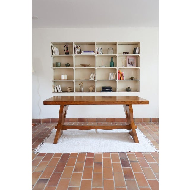 A French brutalist dining table in solid wood, 1960s, and a one-off: this was made by hand, not by a factory. The top is...
