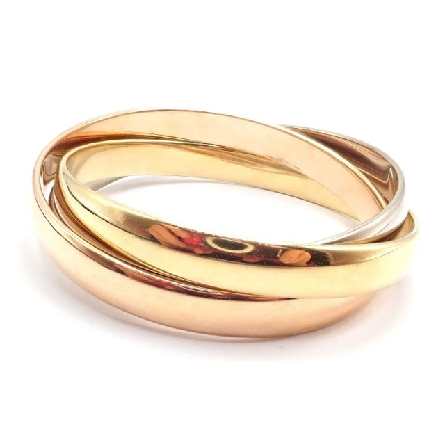 Cartier 1990s Cartier Trinity Rolling Tricolor Gold Large Model Bangle Bracelet For Sale - Image 4 of 9