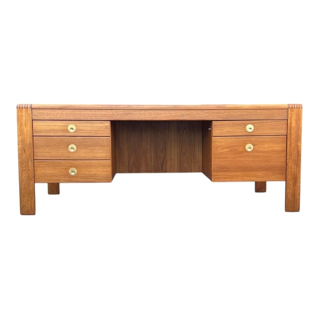 This exceptional mid-century modern executive desk showcases the clean lines and refined craftsmanship of classic Danish...