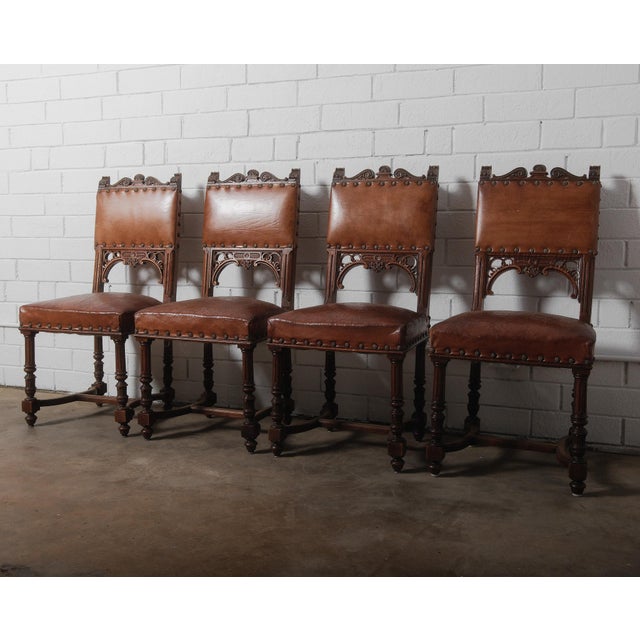Elevate your dining space with this elegant set of four Henry II style dining chairs, expertly crafted with hardwood...