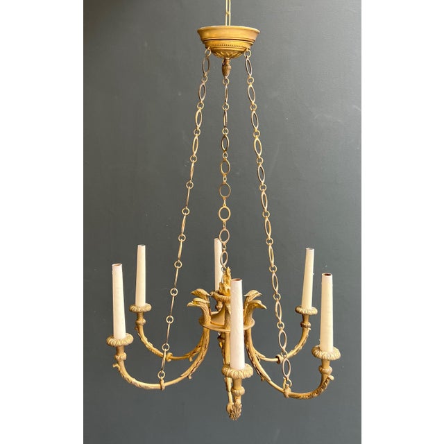 This beautiful Empire-style chandelier with 6 arms is made of chiseled bronze with golden eagle heads around a central...