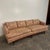 Mid Century Modern Curved Sculpted Wood Sofa. This sofa features upholstered seats and back rest cushions in a fabric.