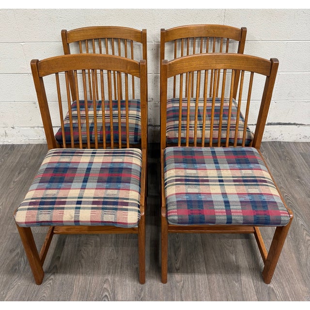 This is a gorgeous set of 4 vintage Mission Arts & Crafts dining chairs by Liberty Furniture. Crafted in solid oak, the...