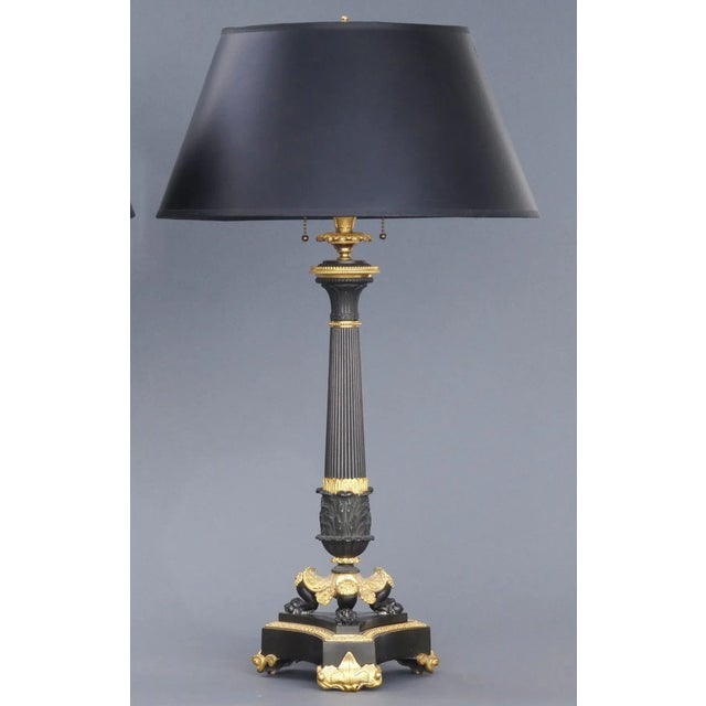 Pair of exceptional French Charles X period bronze and ormolu candlestick lamps with a tapering reeded and acanthus cast...