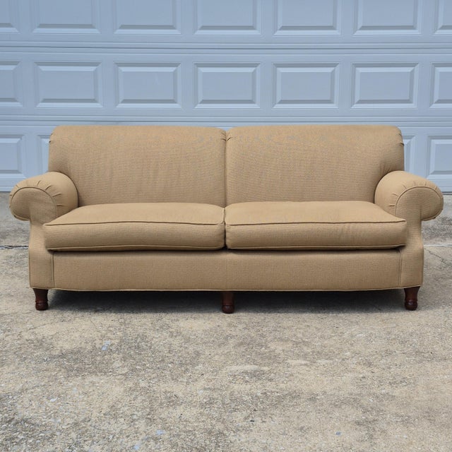 This is an English style rolled arm sofa by high-end American furniture maker Milling Road, a division of Baker Furniture....